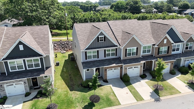 106 Cross Arbor Dr, Simpsonville, SC 29681 - view of front facade featuring board and batten siding, driveway, a garage, a front lawn, and central AC unit