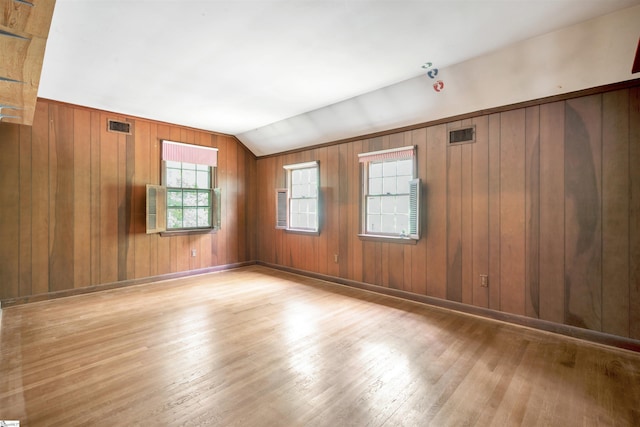 141 Shoreham Rd, Spartanburg, SC 29307 - empty room with wood-type flooring, wooden walls, and vaulted ceiling