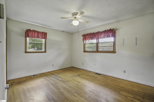 367 Janulis St, Spartanburg, SC 29301 - empty room with plenty of natural light, wood finished floors, baseboards, and ceiling fan