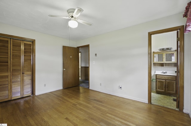 367 Janulis St, Spartanburg, SC 29301 - unfurnished bedroom featuring wood finished floors, baseboards, a closet, and ensuite bath