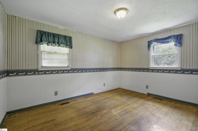367 Janulis St, Spartanburg, SC 29301 - unfurnished room with hardwood / wood-style floors, healthy amount of natural light, and baseboards