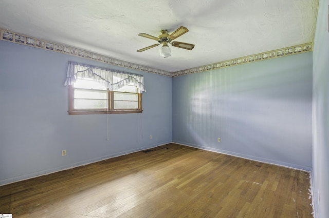 367 Janulis St, Spartanburg, SC 29301 - unfurnished room with wood finished floors, ceiling fan, and baseboards
