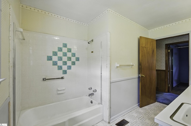 367 Janulis St, Spartanburg, SC 29301 - bathroom featuring tub / shower combination, vanity, wallpapered walls, and wainscoting