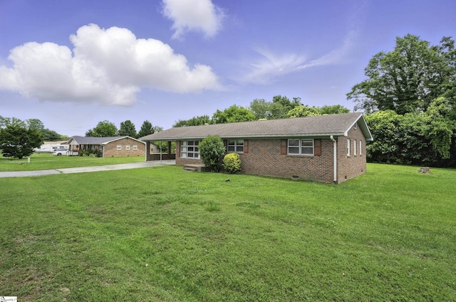 367 Janulis St, Spartanburg, SC 29301 - single story home featuring brick siding, concrete driveway, a front yard, a carport, and crawl space
