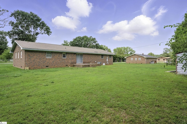 367 Janulis St, Spartanburg, SC 29301 - back of property with crawl space, brick siding, and a yard