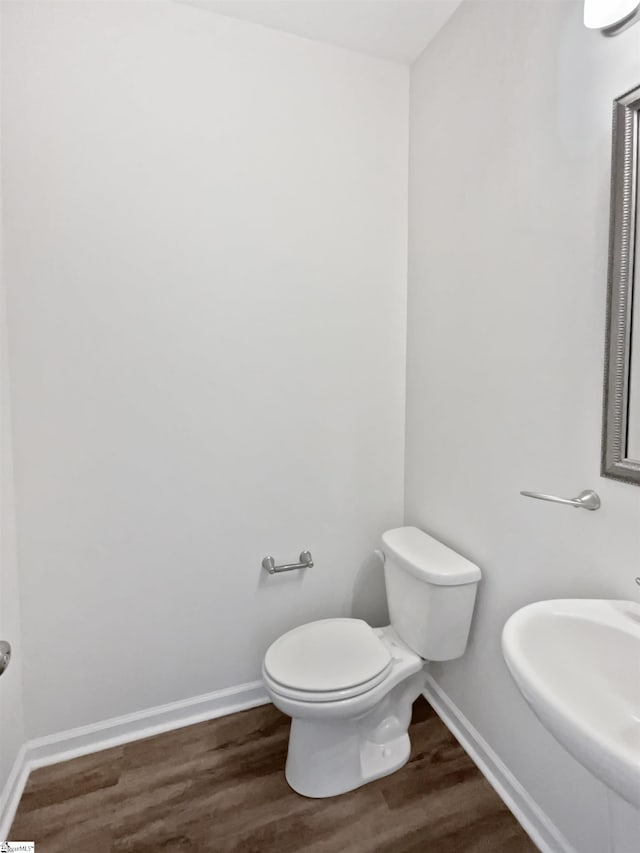 26 Jannison Rd, Boiling Springs, SC 29316 - bathroom featuring wood finished floors, toilet, baseboards, and a sink