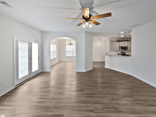 26 Jannison Rd, Boiling Springs, SC 29316 - unfurnished living room with a ceiling fan, arched walkways, dark wood-style flooring, baseboards, and recessed lighting