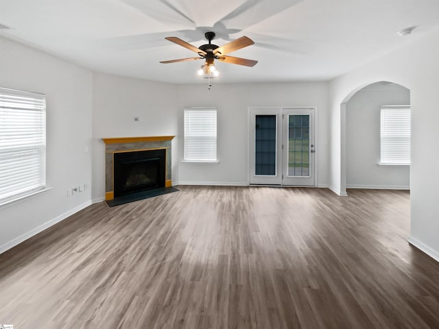 26 Jannison Rd, Boiling Springs, SC 29316 - unfurnished living room with arched walkways, healthy amount of natural light, a ceiling fan, and wood finished floors