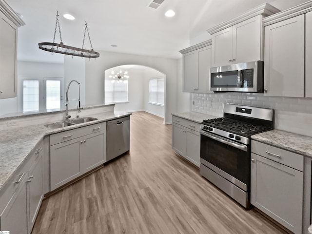 26 Jannison Rd, Boiling Springs, SC 29316 - kitchen featuring appliances with stainless steel finishes, a sink, gray cabinets, arched walkways, and recessed lighting