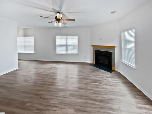 26 Jannison Rd, Boiling Springs, SC 29316 - unfurnished living room featuring ceiling fan, healthy amount of natural light, a fireplace, and wood finished floors