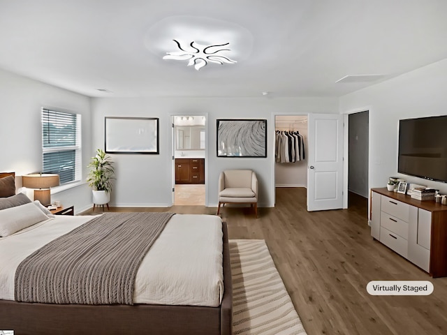 26 Jannison Rd, Boiling Springs, SC 29316 - bedroom with a spacious closet, wood finished floors, baseboards, and connected bathroom
