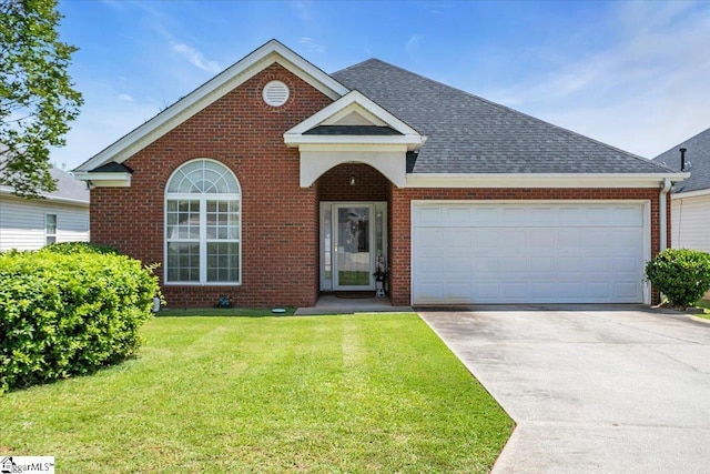 104 Pin Oak Dr, Greenwood, SC 29649 - traditional-style home with brick siding, driveway, roof with shingles, a front yard, and a garage