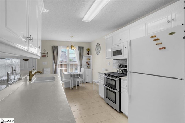 104 Pin Oak Dr, Greenwood, SC 29649 - kitchen featuring white appliances, a sink, white cabinetry, a textured ceiling, and light countertops