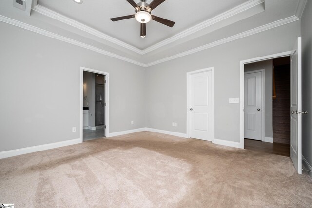 100 Holly Dr, Duncan, SC 29334 - unfurnished bedroom with a tray ceiling, carpet flooring, ornamental molding, baseboards, and ensuite bathroom
