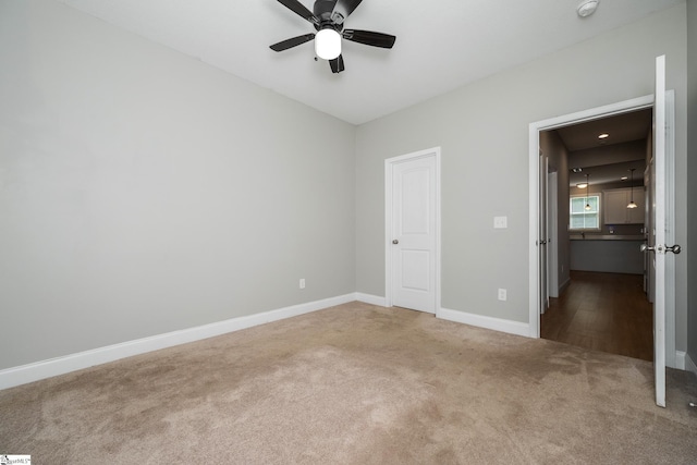 100 Holly Dr, Duncan, SC 29334 - unfurnished bedroom with carpet, baseboards, and a ceiling fan