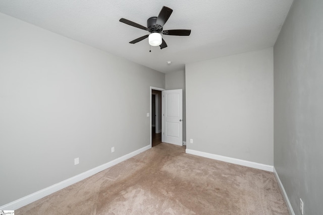 100 Holly Dr, Duncan, SC 29334 - unfurnished bedroom featuring light carpet, baseboards, and ceiling fan