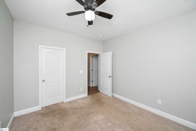 100 Holly Dr, Duncan, SC 29334 - unfurnished bedroom featuring light carpet, baseboards, and ceiling fan