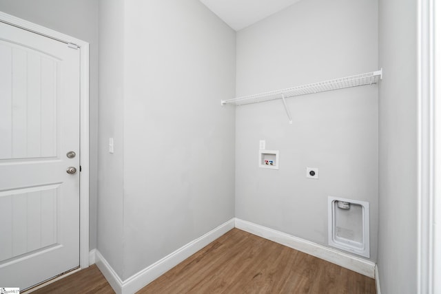 100 Holly Dr, Duncan, SC 29334 - washroom featuring hookup for an electric dryer, washer hookup, wood finished floors, and baseboards