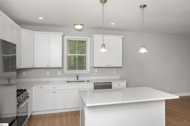100 Holly Dr, Duncan, SC 29334 - kitchen featuring a sink, appliances with stainless steel finishes, light wood-style floors, white cabinets, and recessed lighting