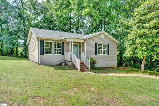 114 Tamelia Ct, Greer, SC 29650 - ranch-style house featuring a front lawn, a shingled roof, and view of wooded area