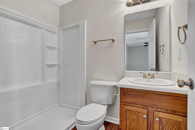 114 Tamelia Ct, Greer, SC 29650 - bathroom with toilet, vanity, a shower, baseboards, and wood finished floors