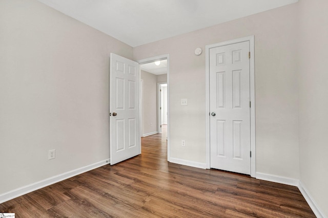 114 Tamelia Ct, Greer, SC 29650 - unfurnished bedroom with dark wood finished floors and baseboards