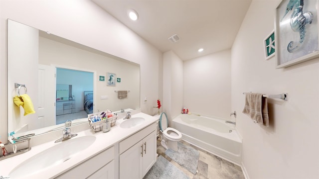 931 Brynderwen Pl, Lyman, SC 29365 - ensuite bathroom featuring double vanity, a garden tub, toilet, stone tile floors, and recessed lighting
