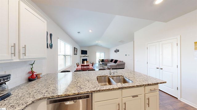 931 Brynderwen Pl, Lyman, SC 29365 - kitchen with stainless steel dishwasher, a sink, dark wood finished floors, backsplash, and vaulted ceiling