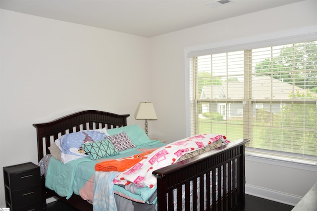127 Riverland Woods Ct, Simpsonville, SC 29681 - bedroom with baseboards and wood finished floors
