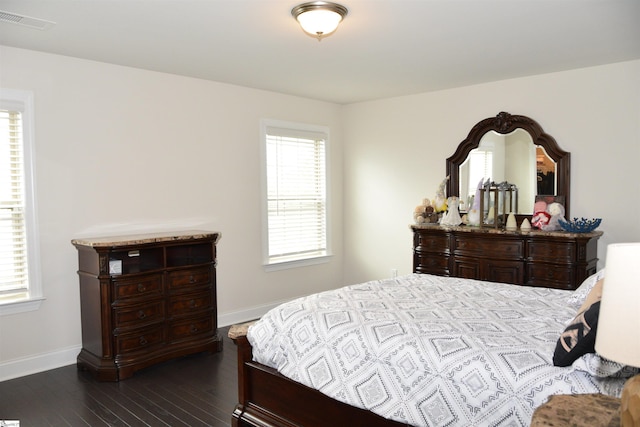127 Riverland Woods Ct, Simpsonville, SC 29681 - bedroom with baseboards and dark wood-style floors