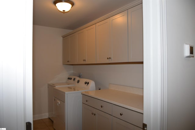 127 Riverland Woods Ct, Simpsonville, SC 29681 - laundry room featuring cabinet space, washing machine and dryer, light tile patterned floors, and baseboards
