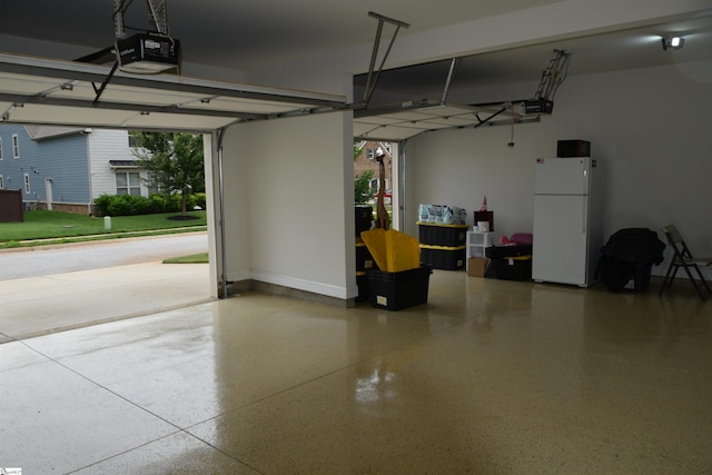 127 Riverland Woods Ct, Simpsonville, SC 29681 - garage with freestanding refrigerator and a garage door opener