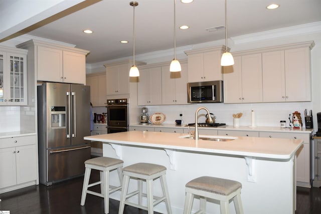 127 Riverland Woods Ct, Simpsonville, SC 29681 - kitchen with stainless steel appliances, decorative backsplash, a sink, light countertops, and ornamental molding