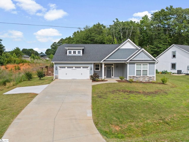 220 Plantation Rd, Greenville, SC 29605 - craftsman inspired home featuring stone siding, concrete driveway, a front lawn, an attached garage, and board and batten siding