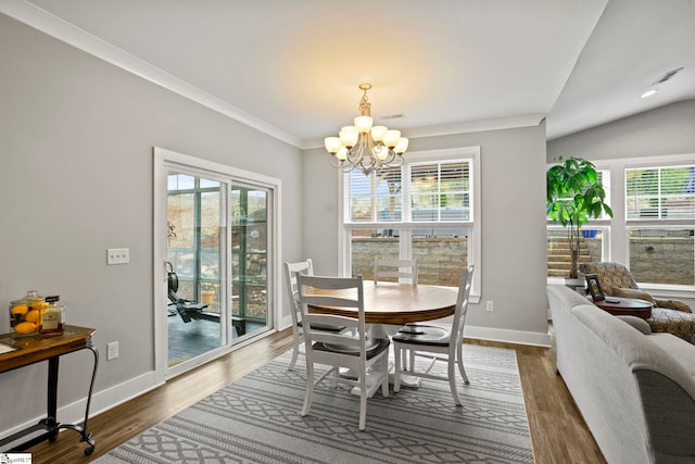 220 Plantation Rd, Greenville, SC 29605 - dining space featuring a chandelier, healthy amount of natural light, crown molding, dark wood finished floors, and lofted ceiling