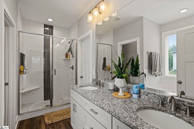 220 Plantation Rd, Greenville, SC 29605 - bathroom with double vanity, a shower stall, wood finished floors, and recessed lighting