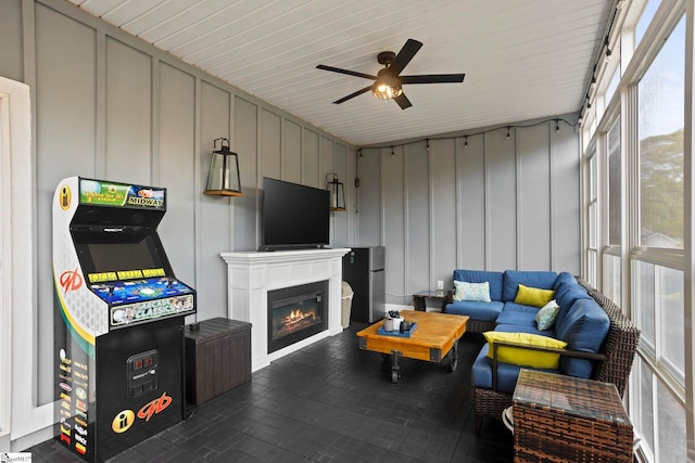 220 Plantation Rd, Greenville, SC 29605 - living room featuring a ceiling fan, a glass covered fireplace, and a decorative wall