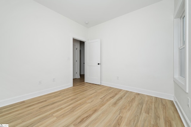 101 Duke St, Greenville, SC 29609 - empty room featuring light wood-style flooring, baseboards, and a smoke detector