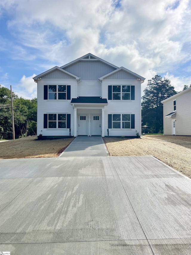 3834 Maid Marion Ln, Spartanburg, SC 29302 - view of front of home featuring an attached garage, driveway, and board and batten siding