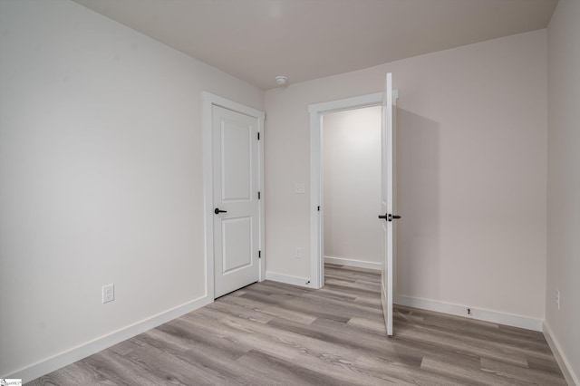 3834 Maid Marion Ln, Spartanburg, SC 29302 - unfurnished bedroom with wood finished floors and baseboards