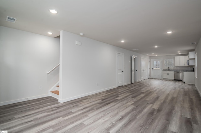 3834 Maid Marion Ln, Spartanburg, SC 29302 - unfurnished living room featuring recessed lighting, wood finished floors, baseboards, and stairs