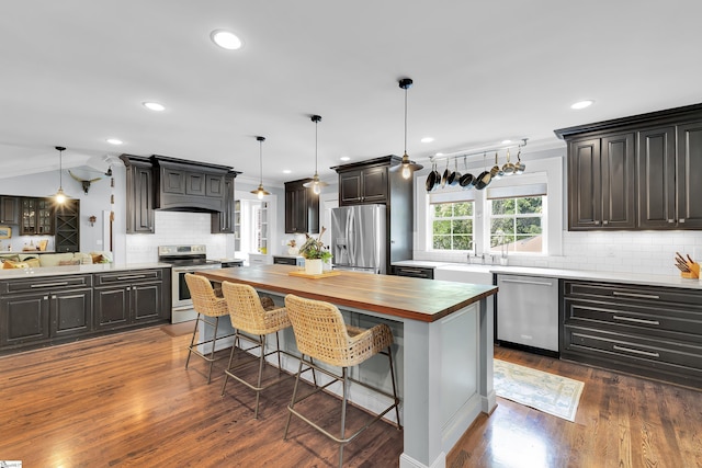15 High Hill St, Greenville, SC 29605 - kitchen with appliances with stainless steel finishes, wooden counters, decorative backsplash, a center island, and a sink