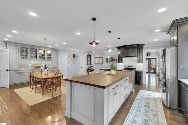 15 High Hill St, Greenville, SC 29605 - kitchen featuring butcher block countertops, appliances with stainless steel finishes, ornamental molding, a center island, and recessed lighting