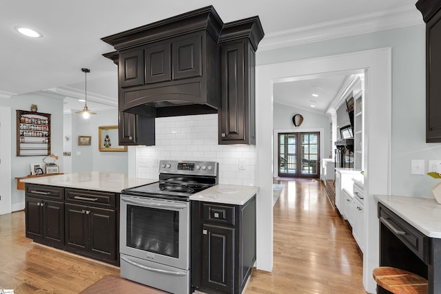 15 High Hill St, Greenville, SC 29605 - kitchen with stainless steel range with electric stovetop, lofted ceiling, light wood-style flooring, backsplash, and dark cabinetry