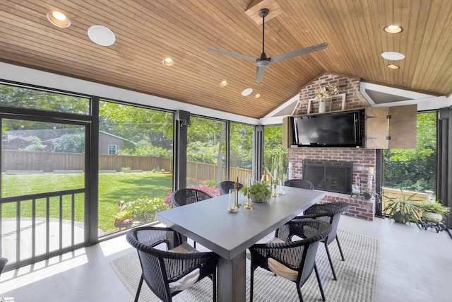 15 High Hill St, Greenville, SC 29605 - sunroom / solarium featuring a brick fireplace, vaulted ceiling, plenty of natural light, and ceiling fan