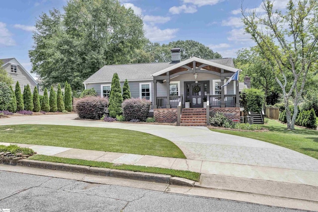 15 High Hill St, Greenville, SC 29605 - view of front of property featuring covered porch, a front lawn, and a chimney