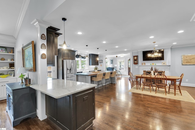 15 High Hill St, Greenville, SC 29605 - kitchen with stainless steel fridge, crown molding, a kitchen bar, a kitchen island, and a chandelier