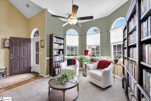 101 Roberts Hill Dr, Taylors, SC 29687 - living area with a high ceiling, crown molding, a ceiling fan, baseboards, and bookshelves