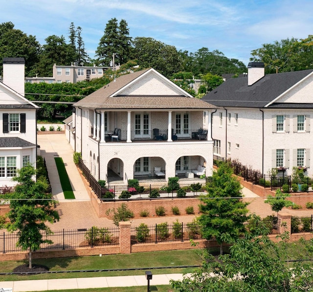 36 Southland Ave, Greenville, SC 29601 - view of front of home with a balcony, a fenced backyard, and french doors
