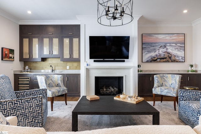 36 Southland Ave, Greenville, SC 29601 - living room with wine cooler, ornamental molding, a chandelier, recessed lighting, and a fireplace